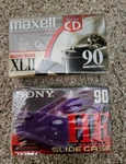 2 Sealed 90 Minute Cassette Tapes - Maxell High Bias & Sony Purple Normal. Fixed Price $6.00.
